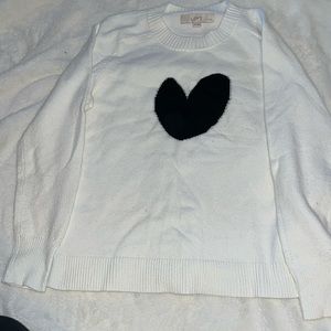 White sweater with a black heart